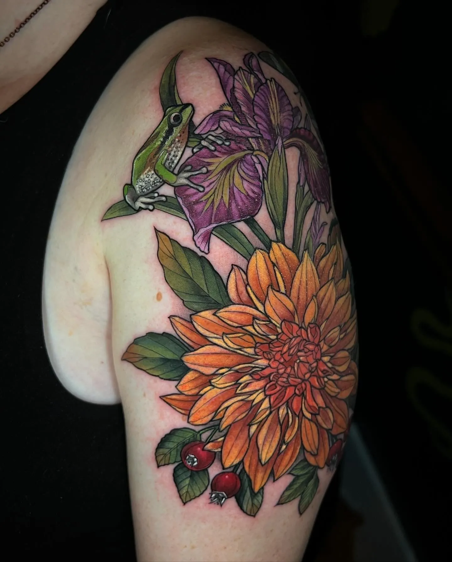 Neo-traditional tattoo of hummingbird and flowers on upper arm by Alice Kendall, tattoo artist in Portland, Oregon