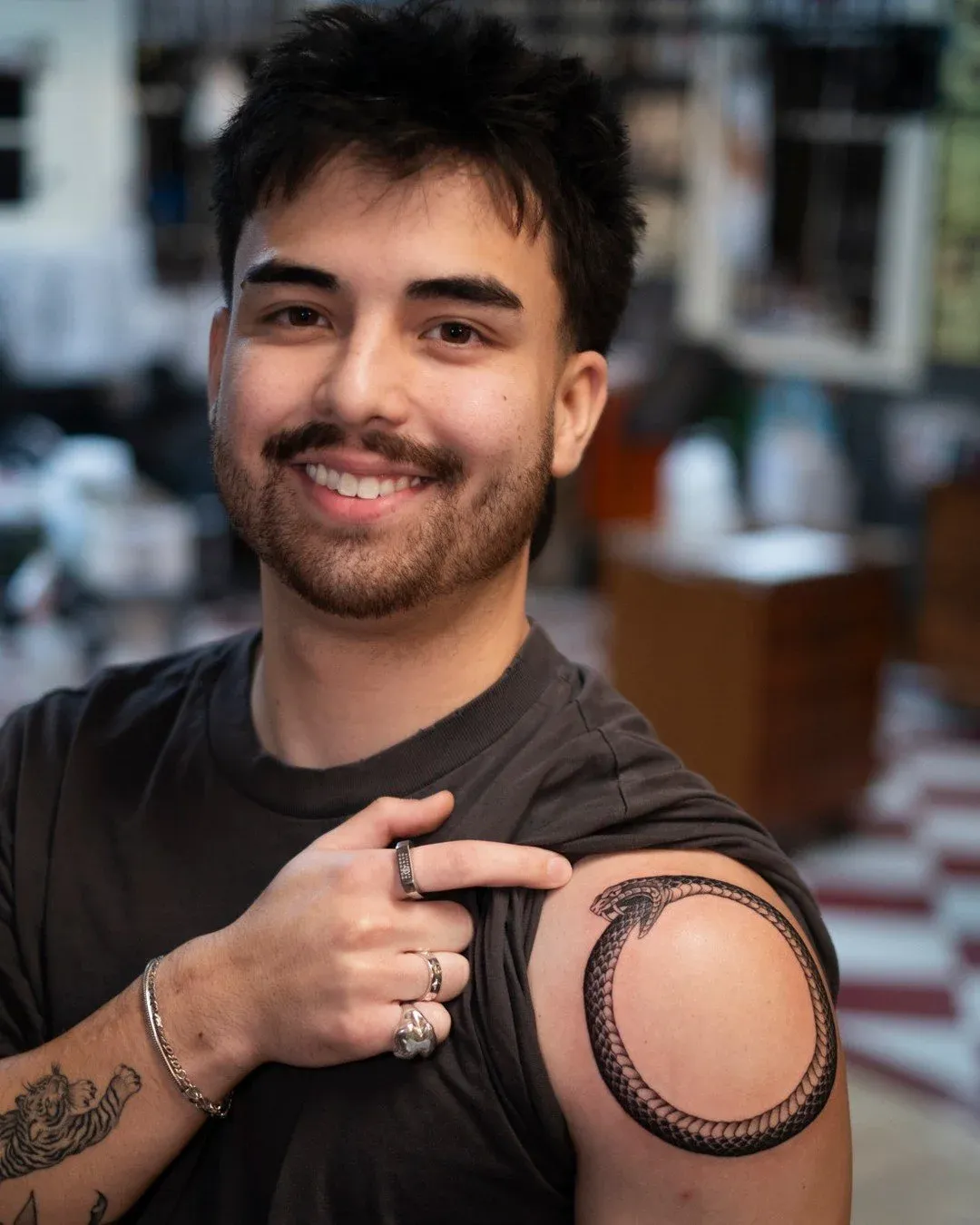 Blackwork tattoo of snake on shoulder by Dan Gilsdorf, tattoo artist in Portland, Oregon