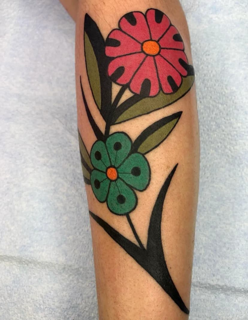 Geometric tattoo of flowers on leg by Derek Yost, tattoo artist in Portland, Oregon