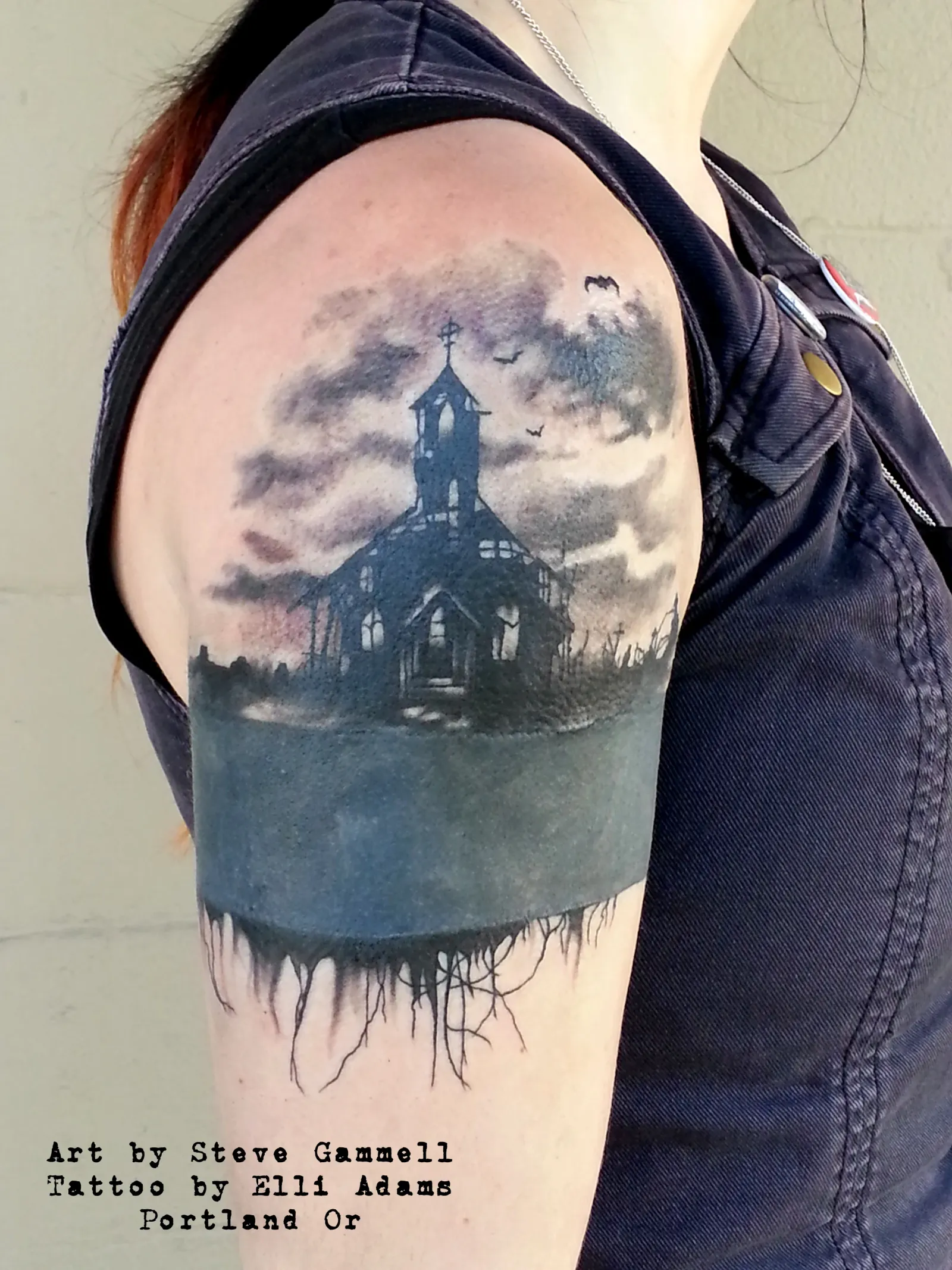 Watercolor tattoo of church and landscape on shoulder by Elli Adams, tattoo artist in Portland, Oregon