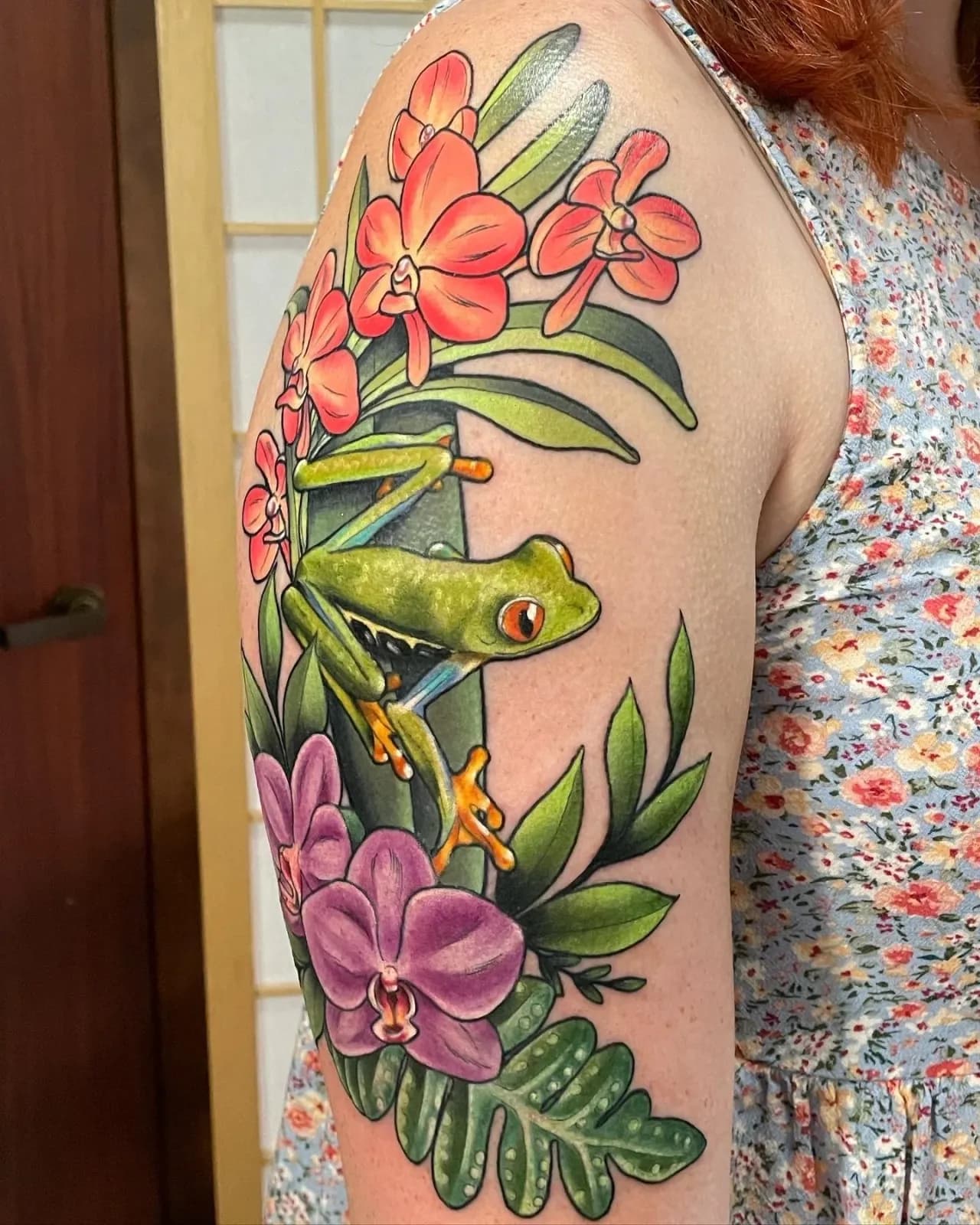 Neo-traditional tattoo of frog and orchids on upper arm by Jennifer Frances, tattoo artist in Portland, Oregon