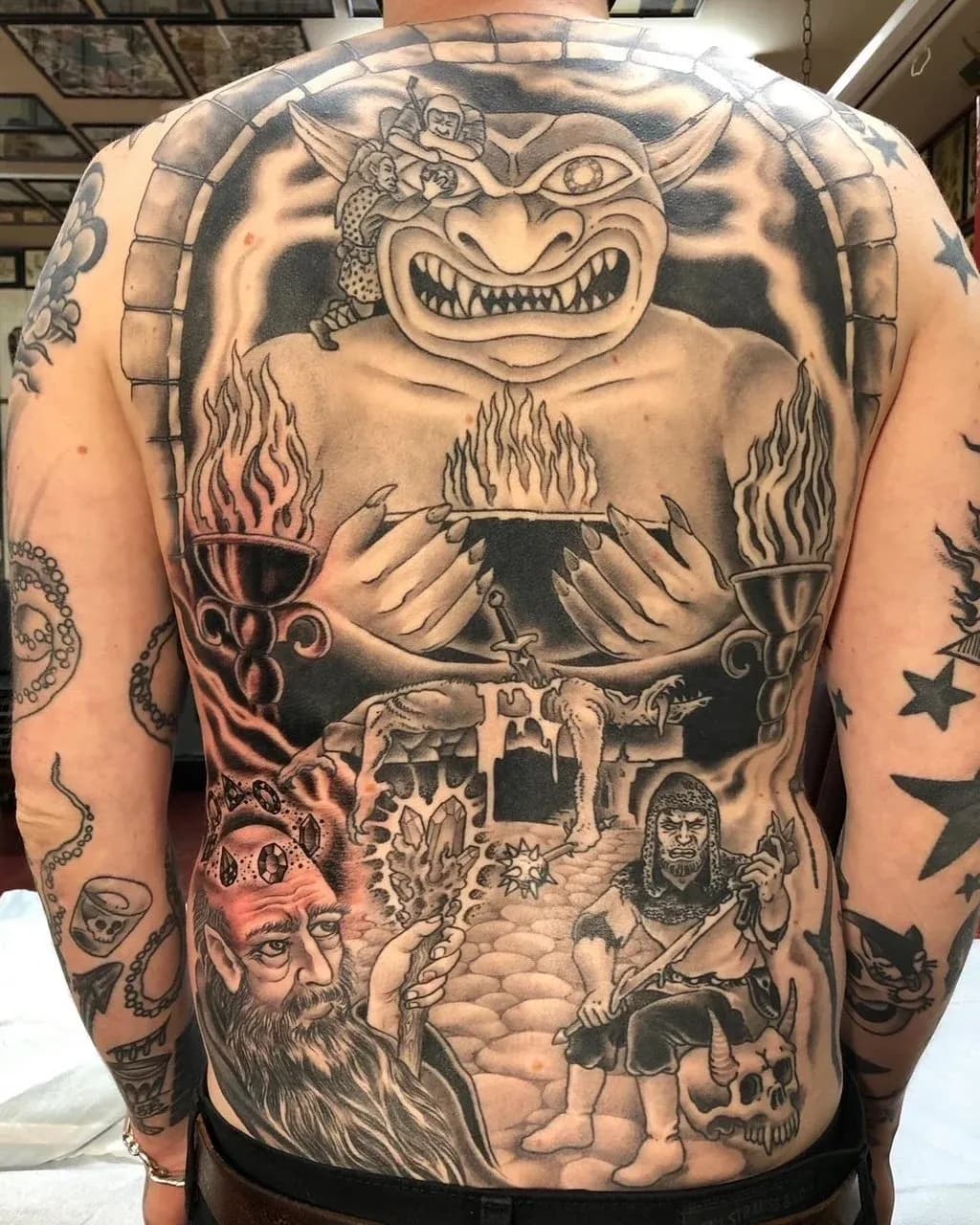 Blackwork tattoo of demon and dungeon on back by Jerry Ware, tattoo artist in Portland, Oregon