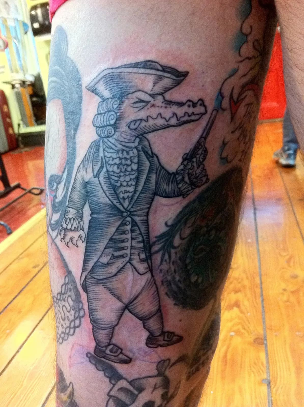Traditional tattoo of alligator and gentleman on forearm by Lewis Hess, tattoo artist in Portland, Oregon