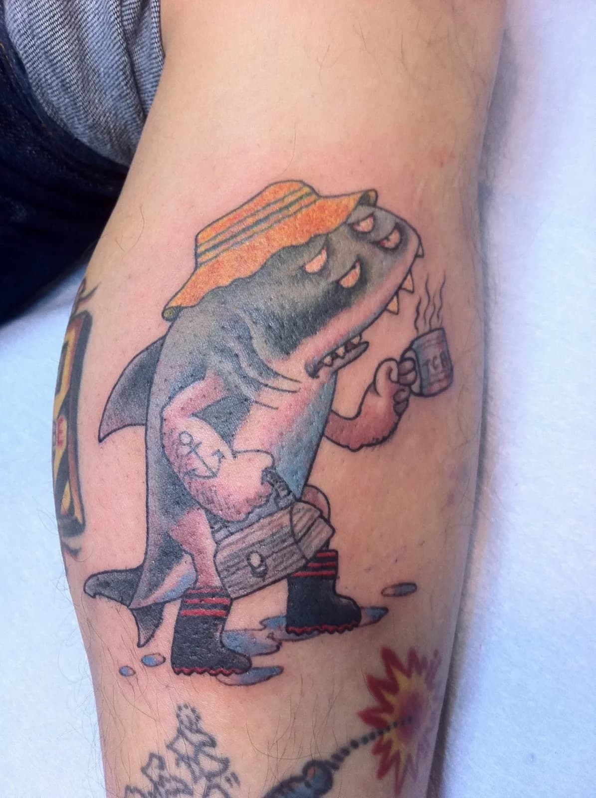 Traditional tattoo of dinosaur and coffee on forearm by Lewis Hess, tattoo artist in Portland, Oregon