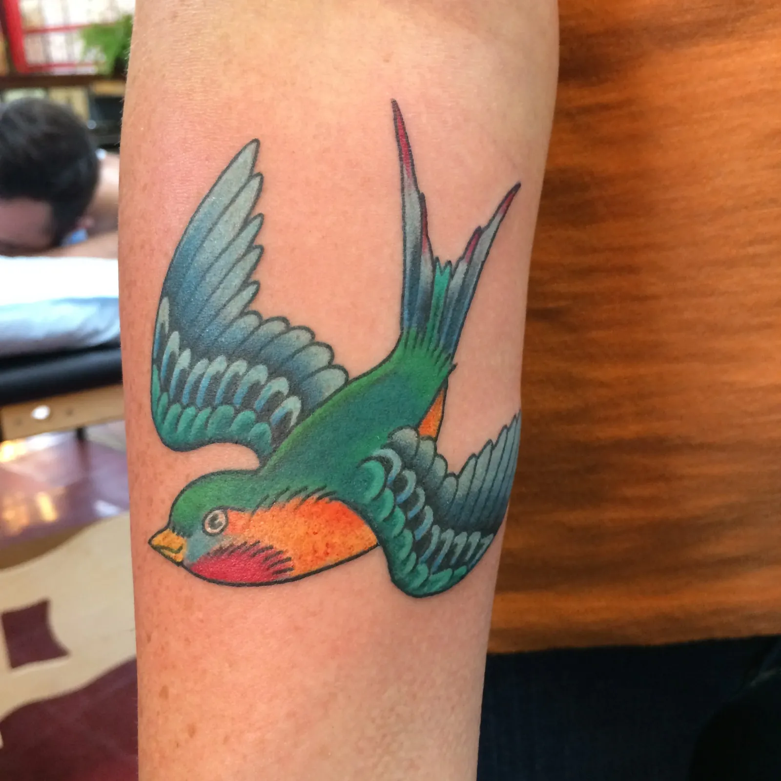 Traditional tattoo of swallow on forearm by Mav Mess, tattoo artist in Portland, Oregon