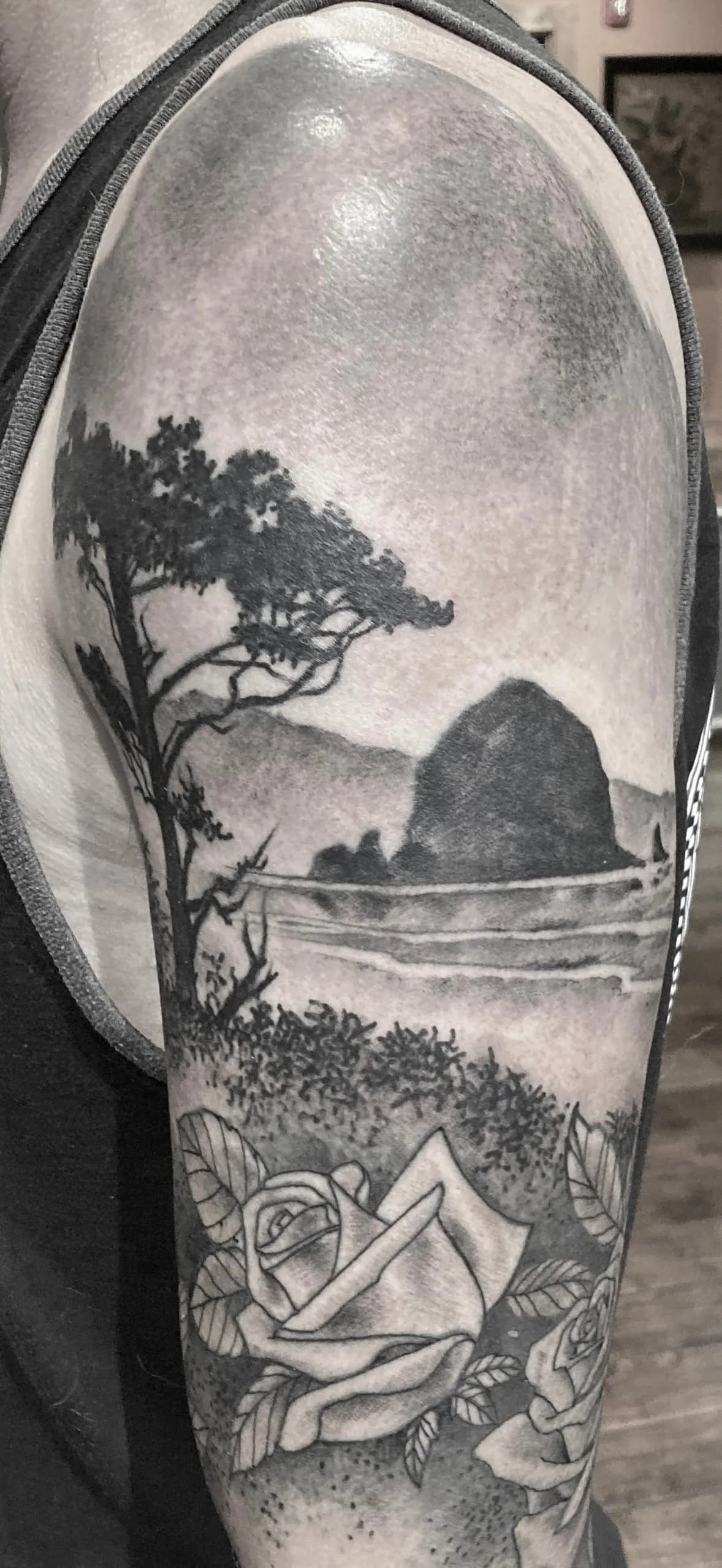 Blackwork tattoo of landscape and rose on sleeve by Michelle Colmus, tattoo artist in Portland, Oregon