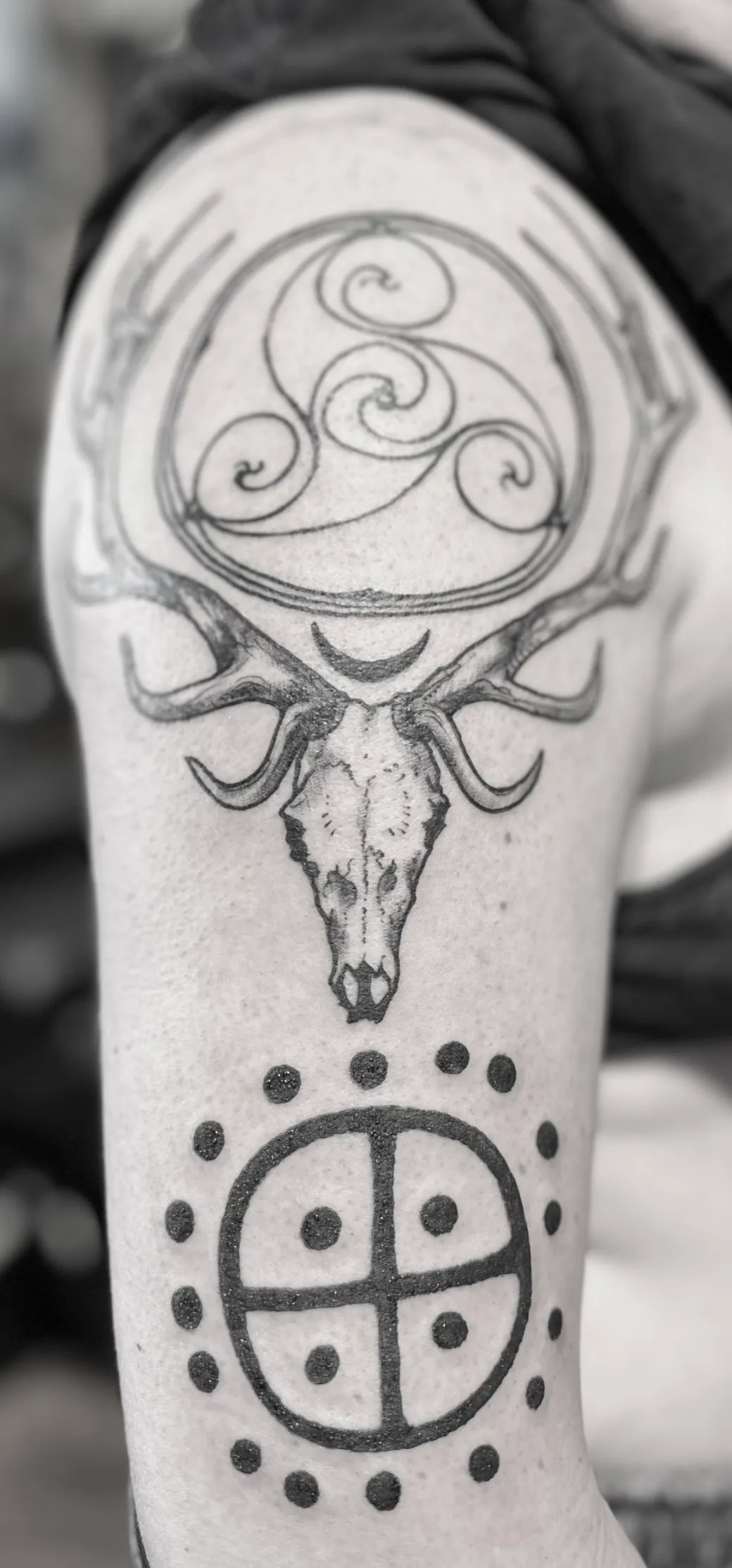 Blackwork tattoo of skull and celtic knot on forearm by Michelle Colmus, tattoo artist in Portland, Oregon
