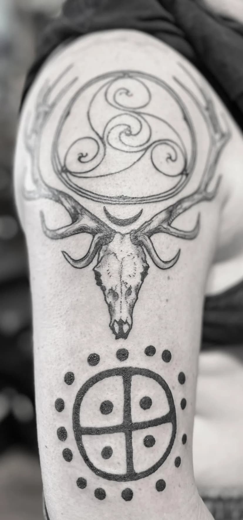 Blackwork tattoo of skull and celtic knot on forearm by Michelle Colmus, tattoo artist in Portland, Oregon