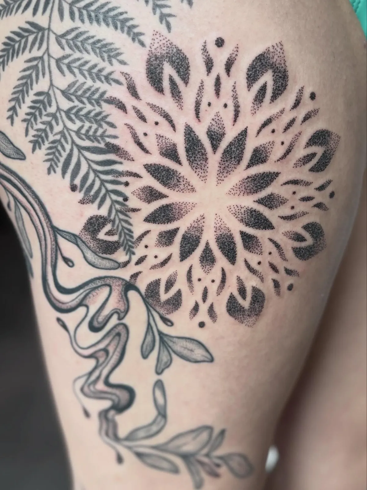Dotwork tattoo of mandala and fern on thigh by Nic Mackin, tattoo artist in Portland, Oregon