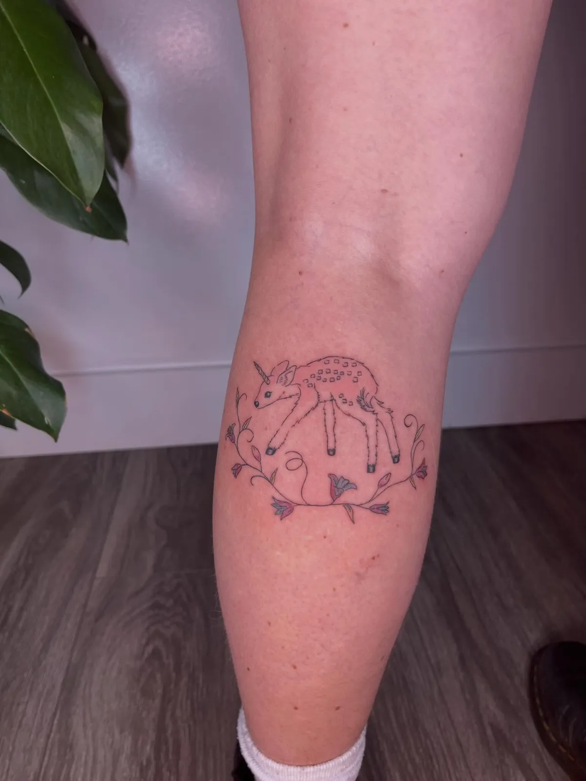 Fine-line tattoo of unicorn on calf by Rae Gently, tattoo artist in Portland, Oregon