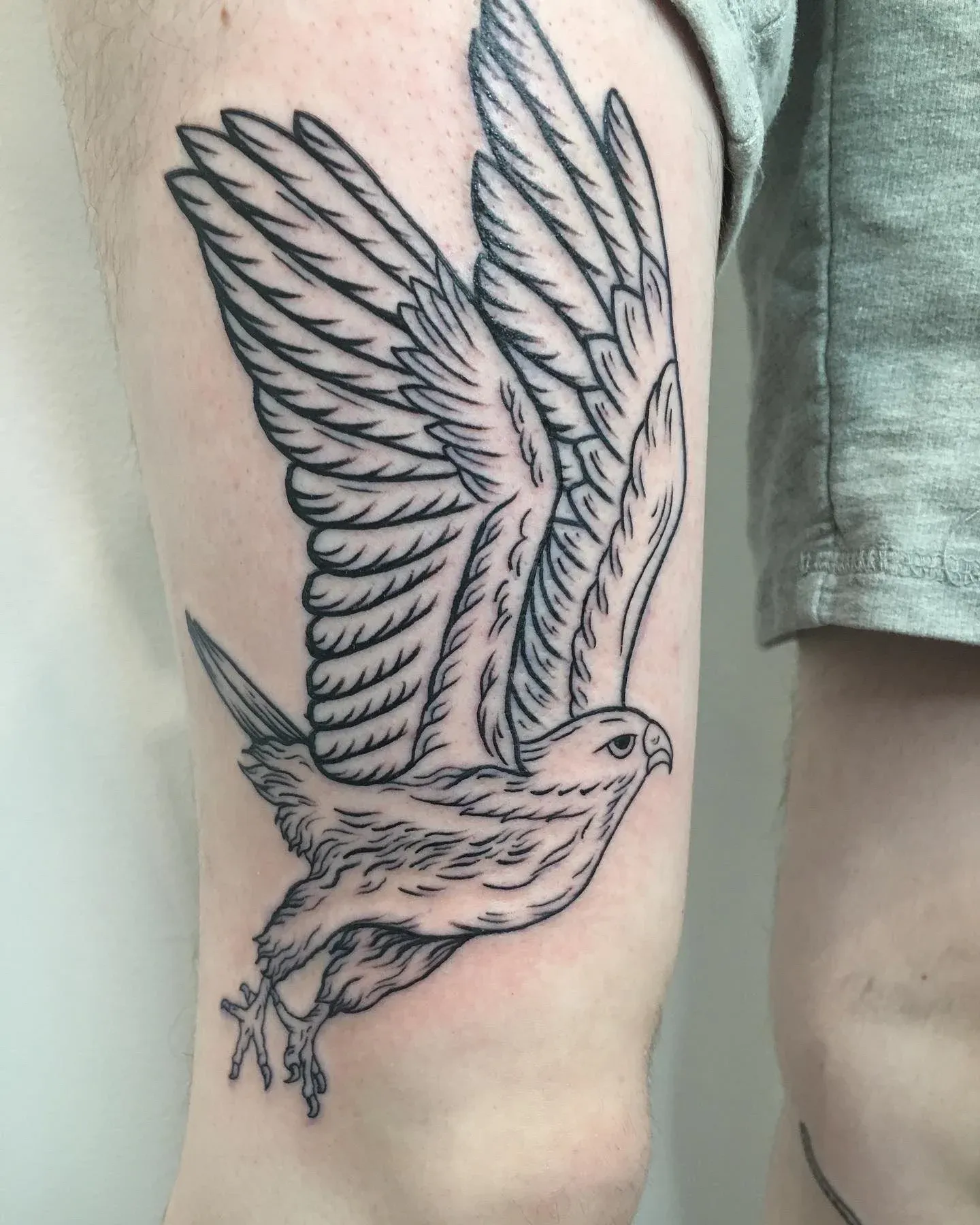 Traditional tattoo of eagle on thigh by Riversteeth, tattoo artist in Portland, Oregon