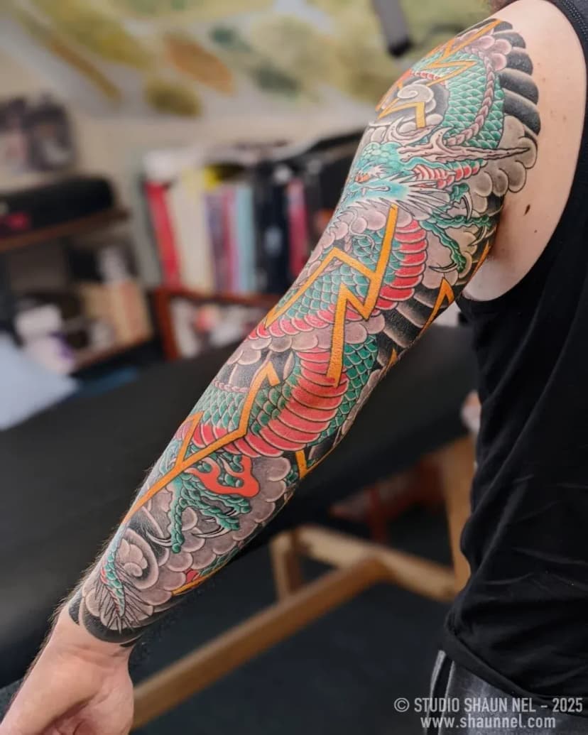 Japanese tattoo of dragon and clouds on arm by Shaun Nel, tattoo artist in Portland, Oregon