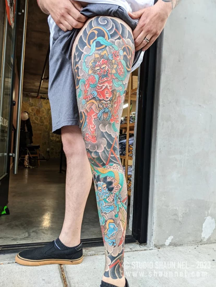 Japanese tattoo of deity and clouds on leg by Shaun Nel, tattoo artist in Portland, Oregon